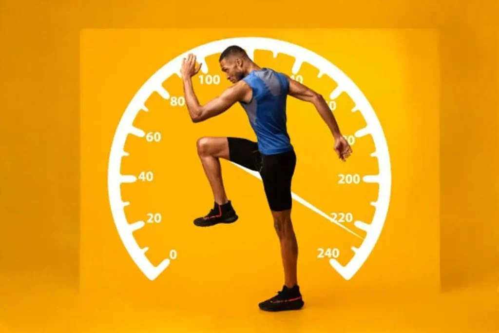 A fit man in a blue and black athletic outfit performs a high-knee exercise against a vibrant yellow background featuring a large speedometer graphic. The imagery symbolizes speed, endurance, and high-intensity interval training (HIIT), emphasizing movement and energy.